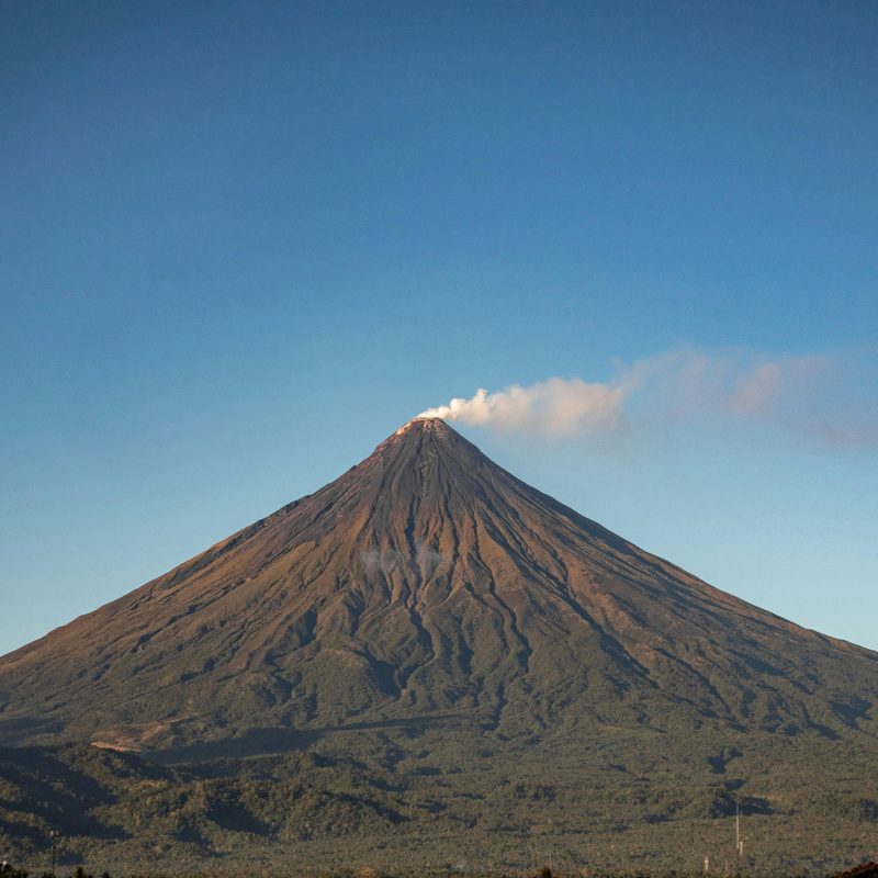 Mayon Volcano rising above Albay in clear morning light.