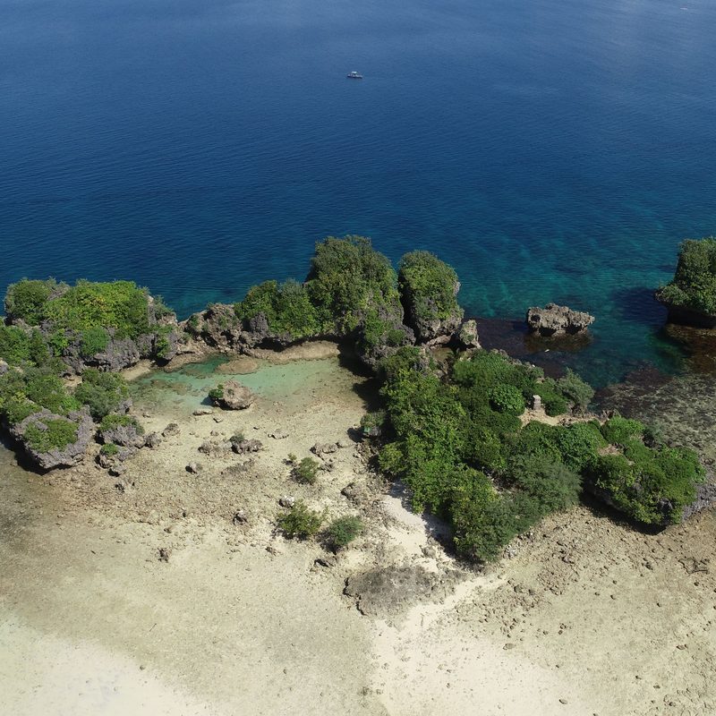 An aerial view of Paguriran Island and its lagoon, ringed by rock and shallow reef in Sorsogon.